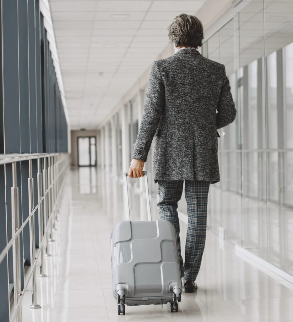business trip corporate and people concept male in gray coat scaled 1 scaled